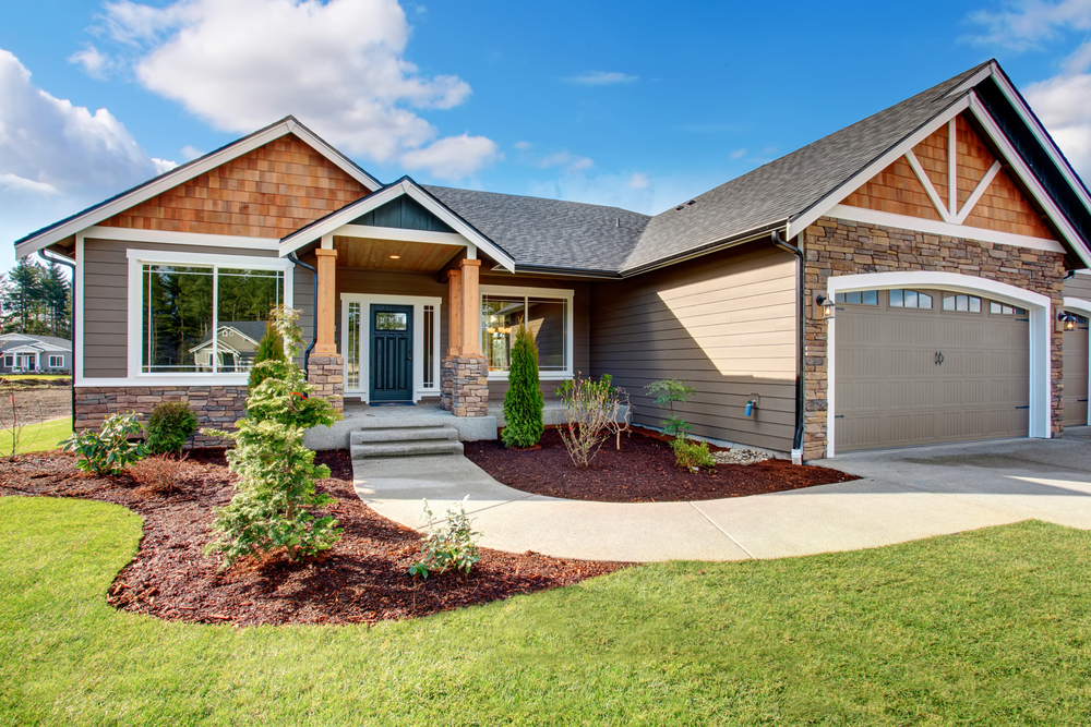 Beautiful landscape designed with maintenance with a stunning appearance to the homes entrance door.